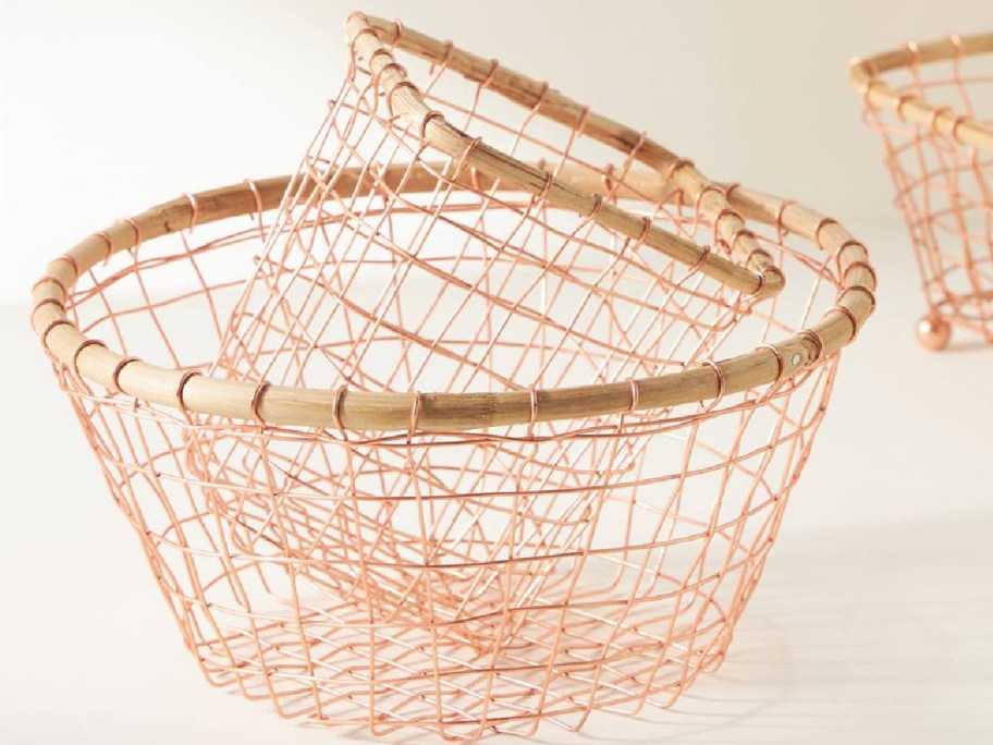 anthropologie baskets displayed on top of the table