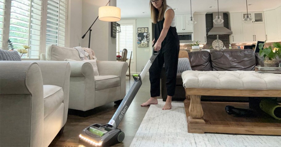 woman cleaning floor with bissel airram vacuum 