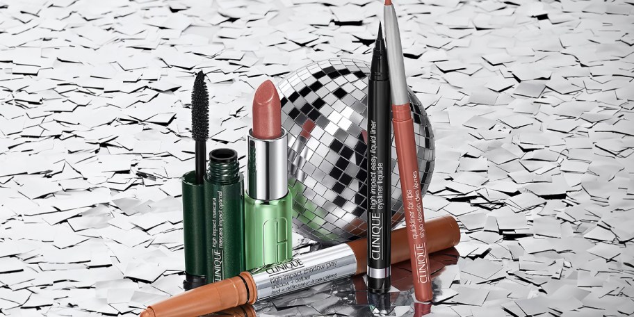 clinique makup products sitting next to disco ball 