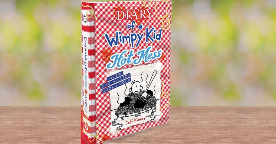 diary of a wimpy kid hot mess book sitting on table