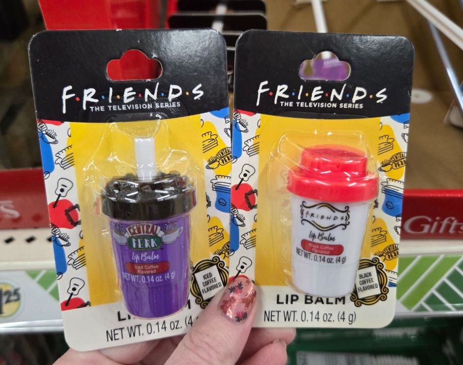 womans hand holding 2 packs of friends lip balm