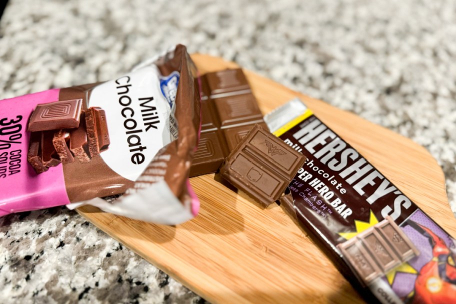 two opened chocolate bars on cutting board