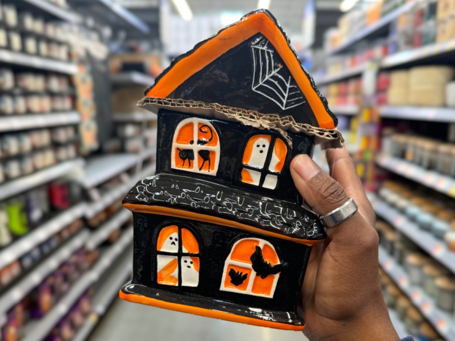 haunted house jar in hand at walmart