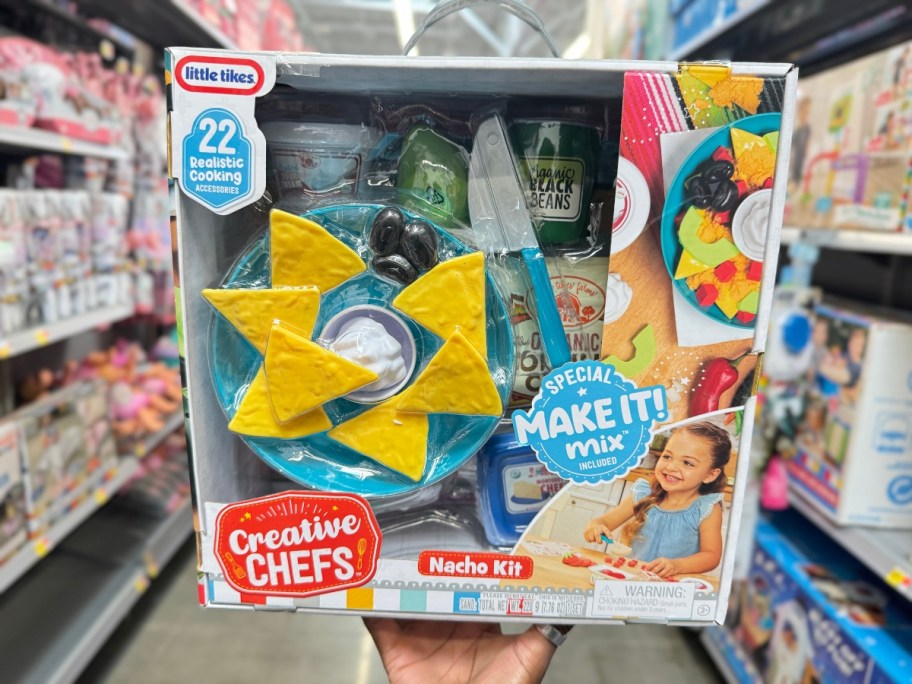 hand holding a box with a Little Tikes Creative Chefs Nacho Kit play set