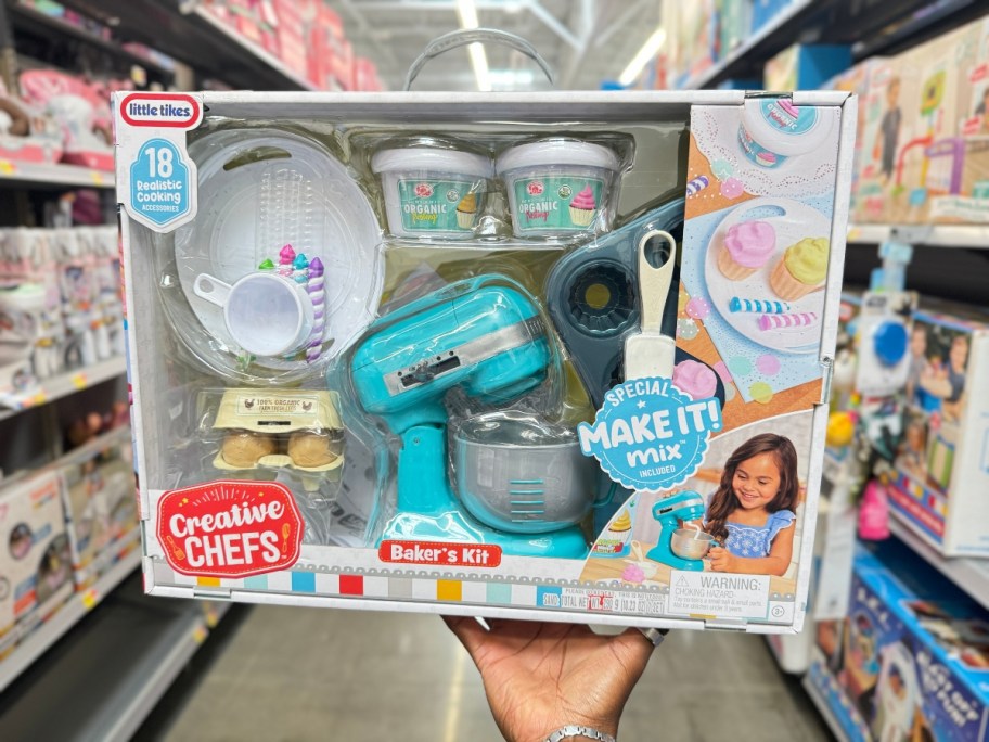 hand holding a box with a Little Tikes Creative Chefs Baker’s Kit with a toy mixer and accessories