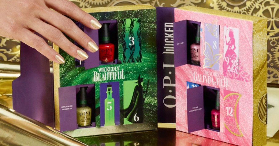 hand reaching for wicked nail polish advent calendar 