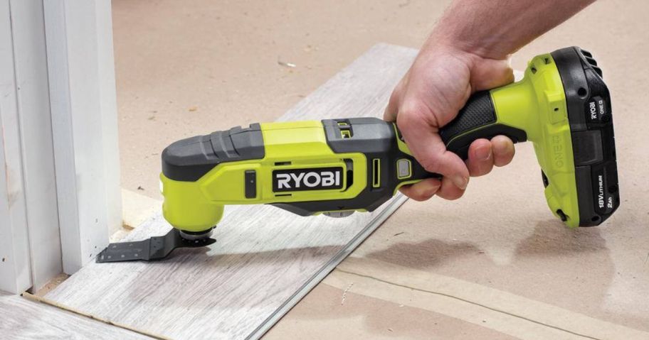 hand using RYOBI power tool