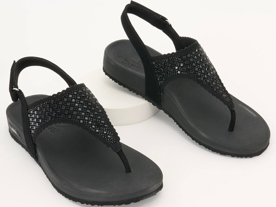 pair of black sketchers sandals 