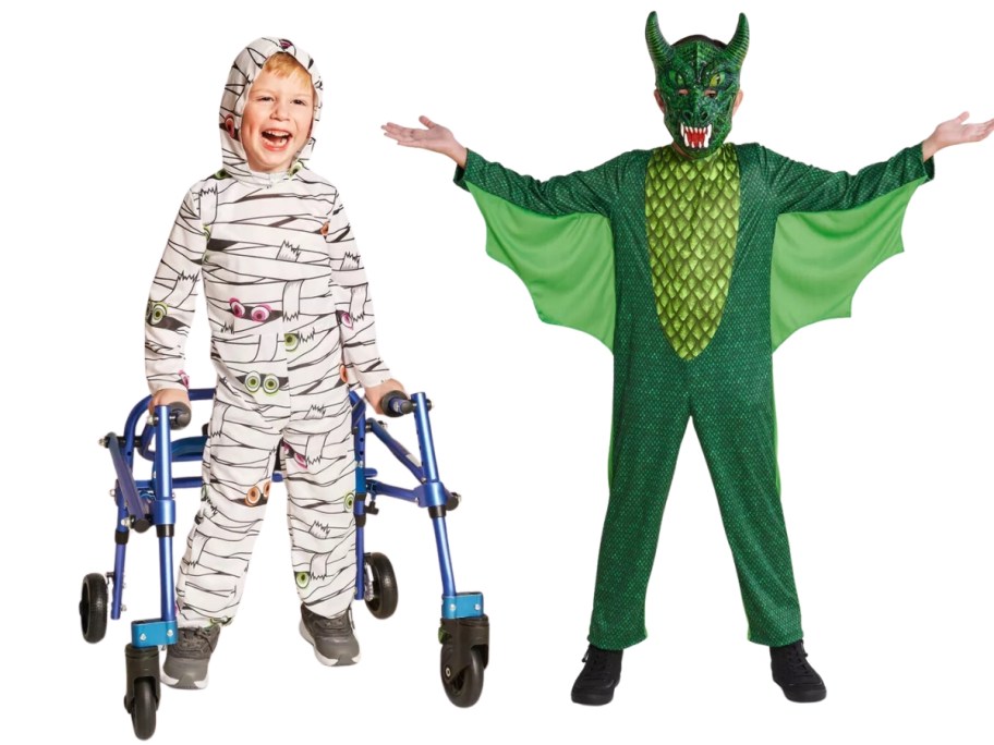 little boy using a walker wearing a white Mummy Halloween costume and a boy in a green dragon costume