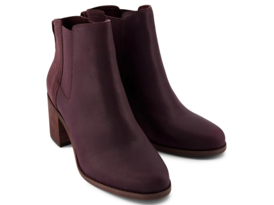 a pair of dark reddish black women's high heel boots