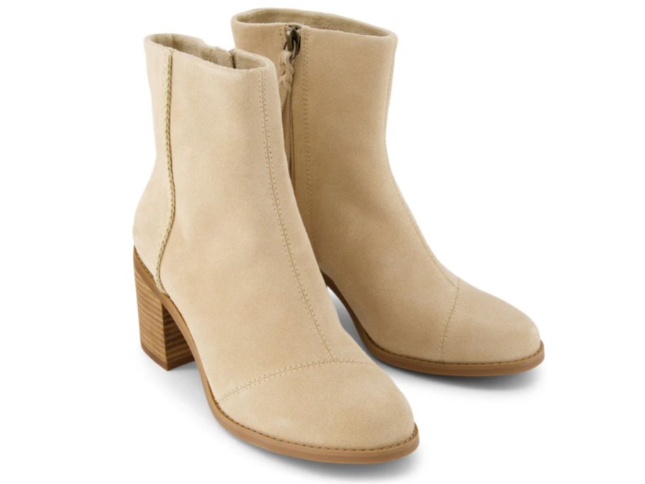 a pair of women's light tan suede heeled boots