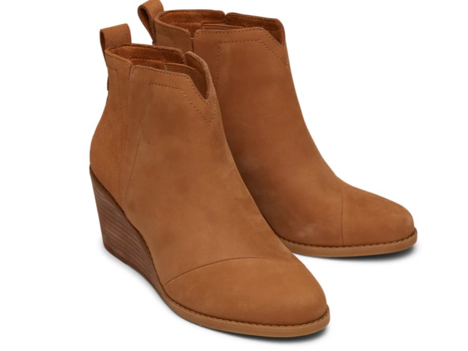 a pair of women's brown wedge ankle boots