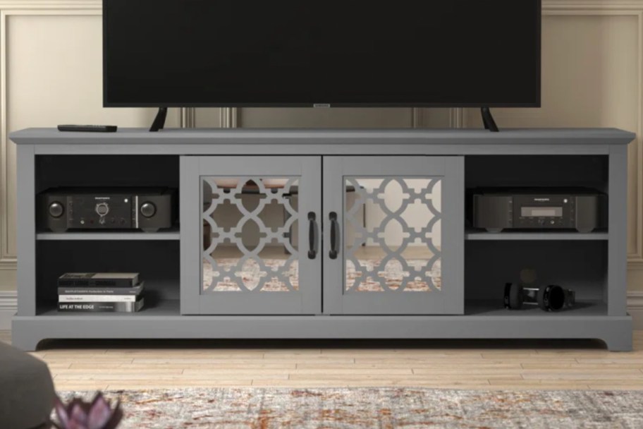 grey tv stand under tv