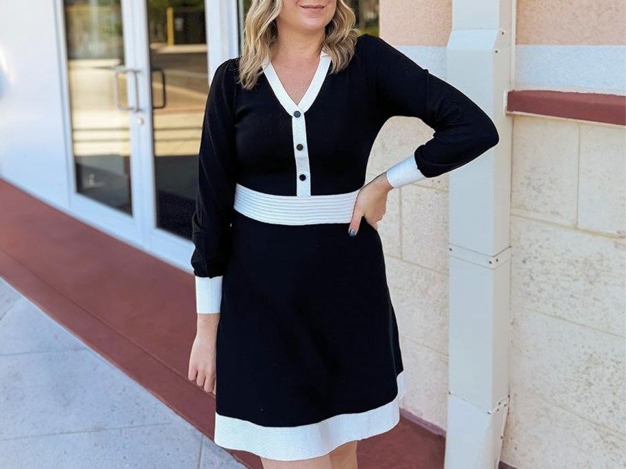 woman wearing black and white mini dress outside