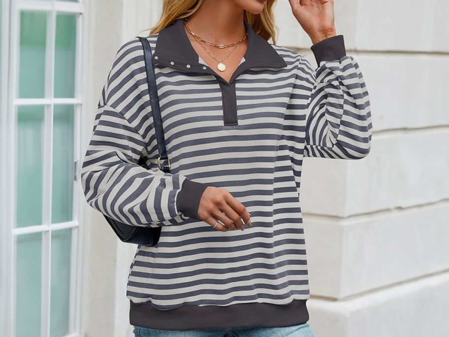 woman wearing gray striped sweater