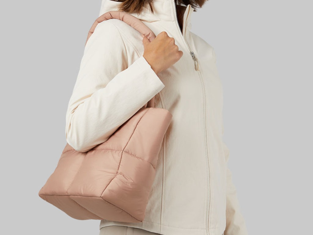 woman wearing 32 degrees puffer tote bag