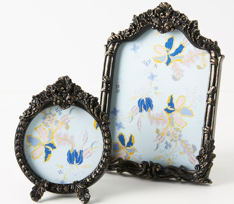 two black floral picture frames