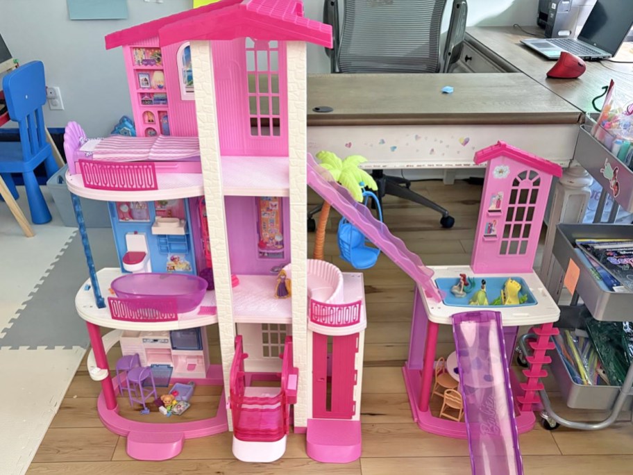 pink 3-story barbie dreamhouse on floor