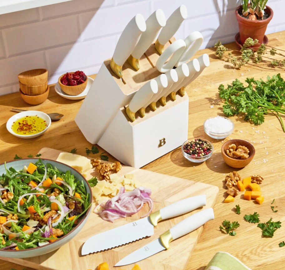 white and gold knife block set on kitchen counter