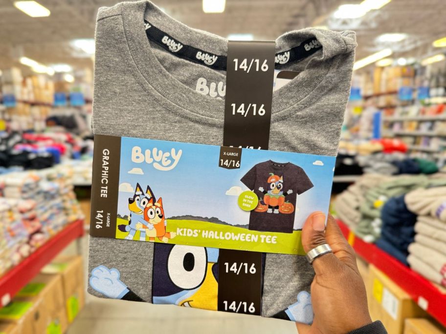 Hand holding up a kids Bluey Halloween Tee from Sam's Club