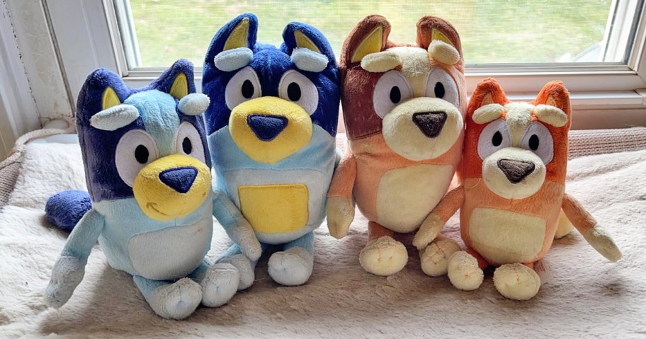 Bluey Heeler Family Plush Set sitting on bed