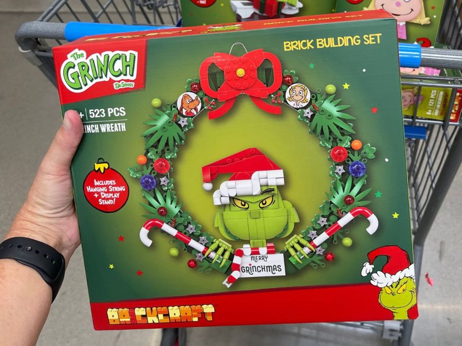 Brickcraft Grinch Wreath Brick Building Kit in hand in store