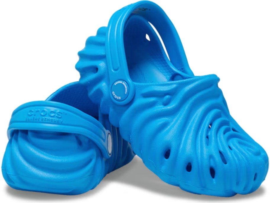 pair of blue little kids Crocs clogs with a ridged, rippled, swirl type design