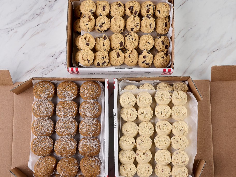 three boxes of frozen David's Cookies dough