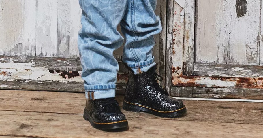 girl wearing jeans and black sparkly boots