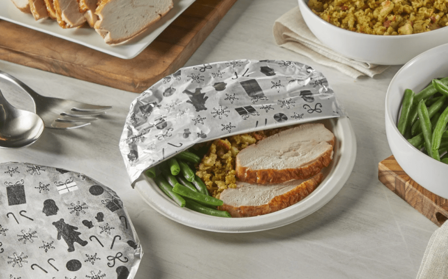 Embossed Reynold's Wrap covering holiday dishes