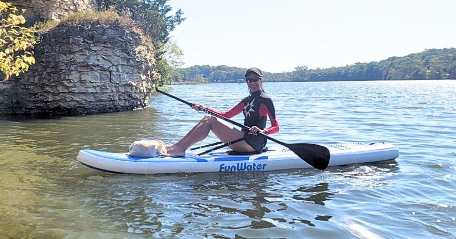 Woman sitting on a Funwater Paddle Board