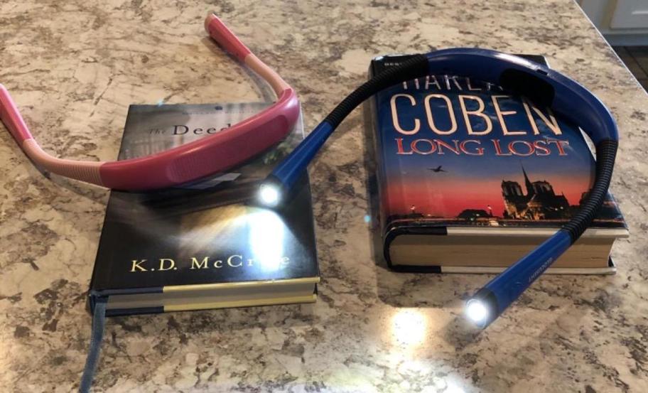 pink and blue neck light on books on countertop