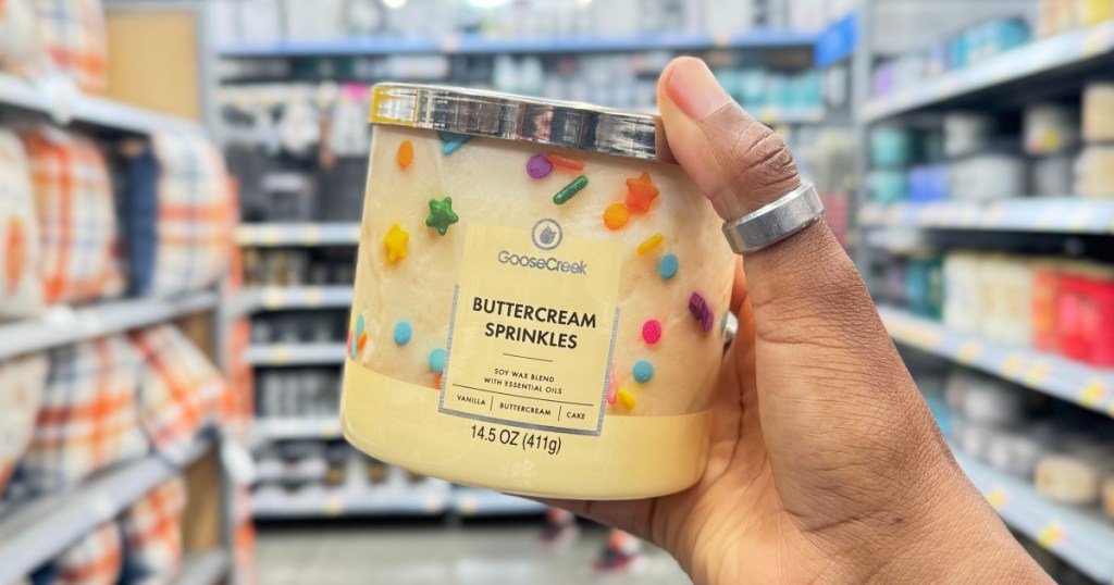 person holding GooseCreek ButterCream Candle in walmart