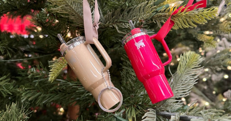 mini tan/gold and red Stanley Tumbler keychain ornaments hanging a Christmas tree