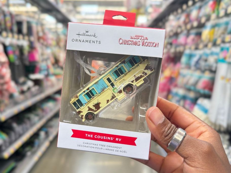 Hallmark National Lampoon's Christmas Vacation Cousin's RV Ornament in hand in store