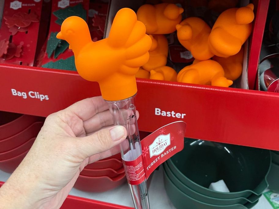 hand holding Holiday Time Turkey Baster