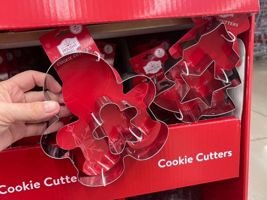 hand holding Holiday Time cookie cutters