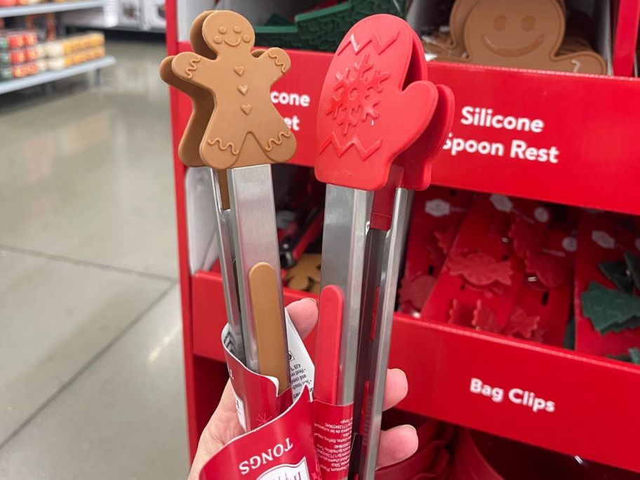 hand holding Holiday Time tongs