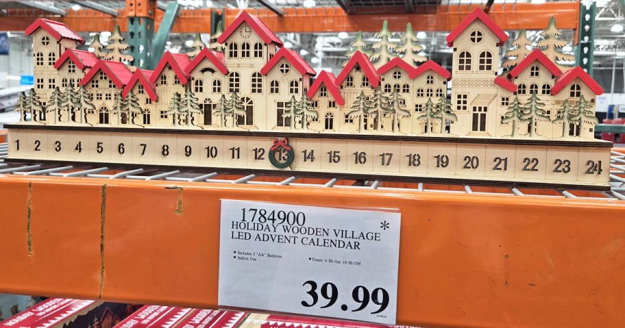 wooden village advent calendar on display in store