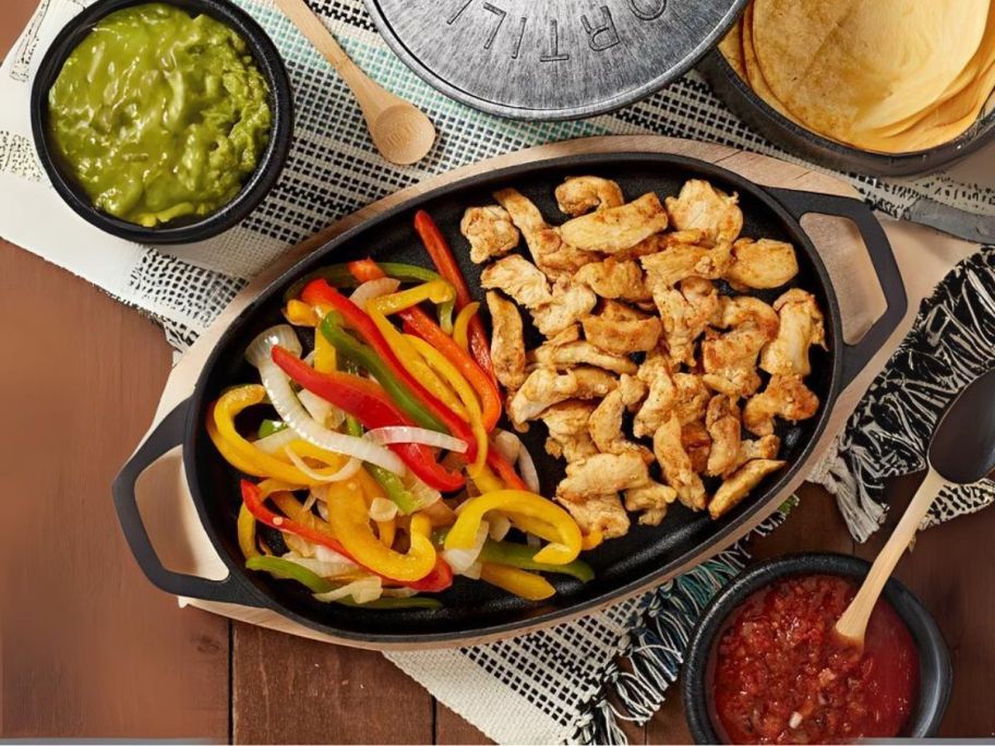 Infuse Latin Cast Iron 8-Piece Fajita Set on table