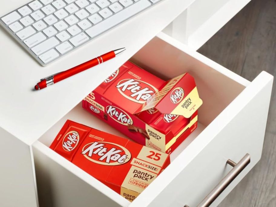 A desk with two Kit Kat Pantry packs in the top drawer