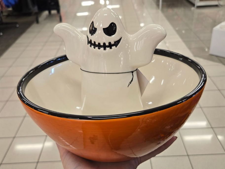 Hand holding a Halloween Characters 10" Candy Dish with a ghost figural in the center