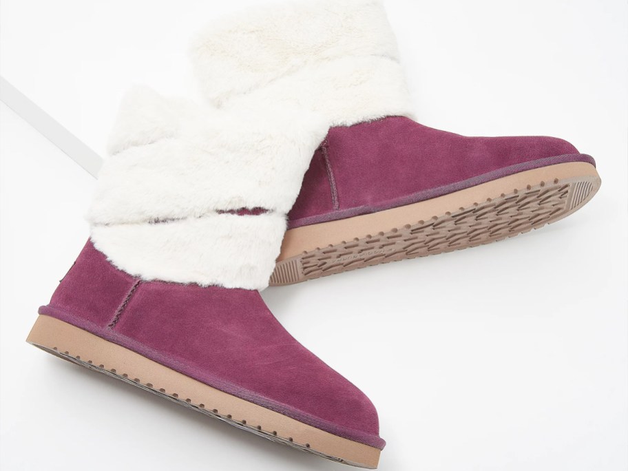 pair of purple boots with white fur on the top