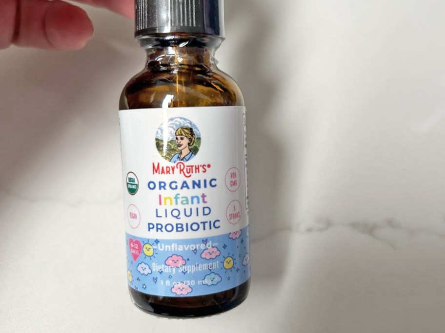 hand holding a bottle of MaryRuth Organics Infant Liquid Probiotic Drops