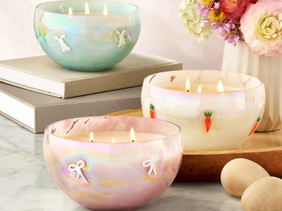 three pastel iridescent icon candles