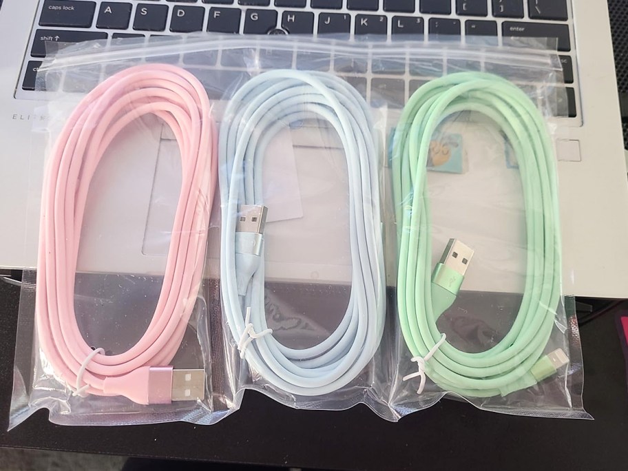 three pastel iphone charging cables in bag