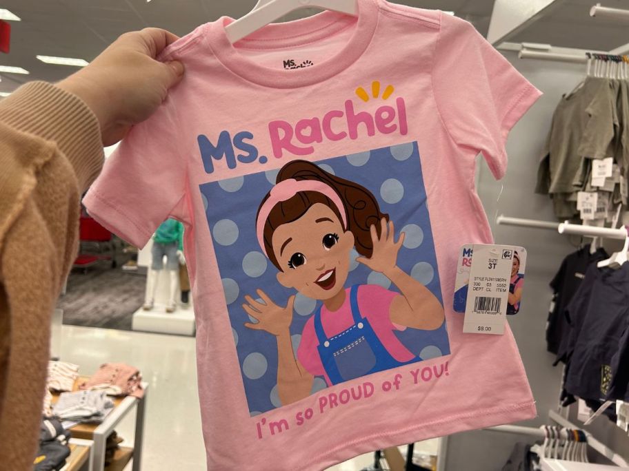 Hand holding up a Ms. Rachel Tee from target