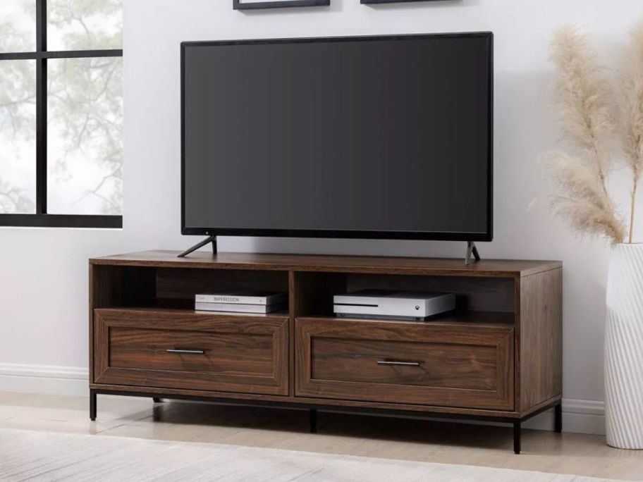 Saracina Home Orin Modern 2-Drawer TV Stand with tv on it