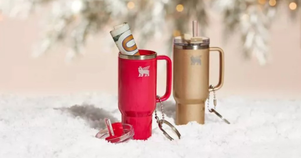 pink and champagne colored Stanley Tumbler Ornaments under christmas tree