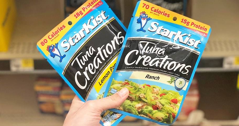 hand holding up two packets of StarKist Tuna Creations